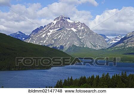 Rising Wolf Mountain, Two Medicine Mountain Lake, Glacier National Park, Rocky Mountains, Montana, USA, North America View Large Photo Image Stock Photo - Rising Wolf Mountain, Two Medicine Mountain Lake, Glacier National Park, Rocky Mountains, Montana, USA, North America. Fotosearch