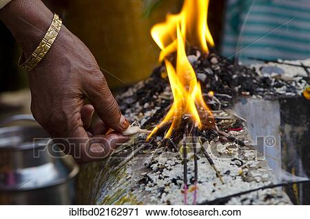 Stock Image - Rituals being performed at the ghats of Varanasi, Uttar Pradesh, India, Asia. Fotosearch