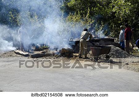 Stock Photo - Road construction in a rural area of Arunachal Pradesh is still done mainly by hand, Tago village, Arunachal Pradesh, India, Asia. Fotosearch