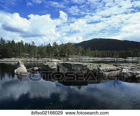 Stock Photo - Rocky landscape a the wide Otra river in northern Setesdal Valley, Aust-Agder, Norway, Scandinavia, Europe. Fotosearch