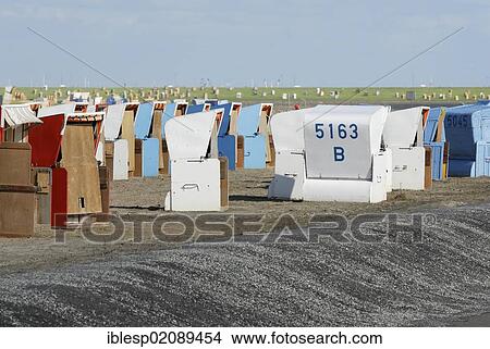 Picture - Roofed wicker beach chairs, Buesum, district of Dithmarschen, Schleswig-Holstein, North Sea, Wadden Sea, Germany, Europe, PublicGround, Europe. Fotosearch