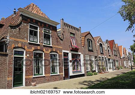 Row of houses in Oudeschild, Texel, The Netherlands, Europe, PublicGround, Europe View Large Photo Image Stock Photo - Row of houses in Oudeschild, Texel, The Netherlands, Europe, PublicGround, Europe. Fotosearch