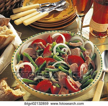 Stock Photo - Salad Nicoise, French classic with green beans, tomatoes, anchovies and pickled tuna, France, Europe. Fotosearch