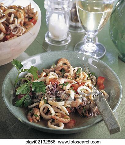 Seafood salad, calamari, shrimp and mussels with tomato and herbs, Italy, Europe View Large Photo Image Stock Photograph - Seafood salad, calamari, shrimp and mussels with tomato and herbs, Italy, Europe. Fotosearch