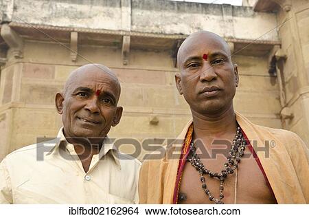Shaving head and beard is part of the ritual to bid farewell to the soul of a deceased person, at the ghats of Varanasi, Uttar Pradesh, India, Asia View Large Photo Image Picture - Shaving head and beard is part of the ritual to bid farewell to the soul of a deceased person, at the ghats of Varanasi, Uttar Pradesh, India, Asia. Fotosearch