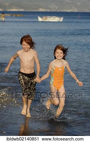 Siblings running on the beach, happy, Samos island, southern Sporades, Aegean sea, Greece, Europe View Large Photo Image Stock Image - Siblings running on the beach, happy, Samos island, southern Sporades, Aegean sea, Greece, Europe. Fotosearch