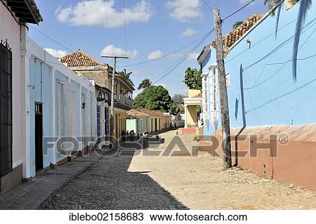 Stock Image - Side street, cobbled street, old town, Trinidad, Cuba, Greater Antilles, Caribbean, Central America, America, North America. Fotosearch