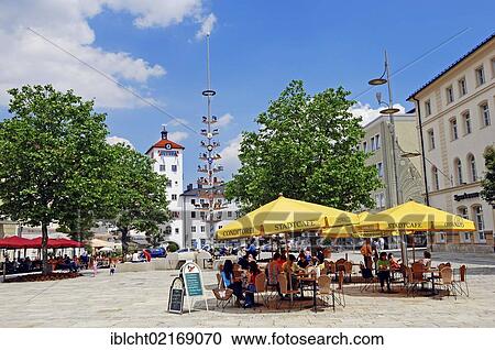 Stock Image - Sidewalk cafe on Marktplatz square and Jacklturm tower, Traunstein, Chiemgau, Bavaria, Germany, Europe, PublicGround, Europe. Fotosearch