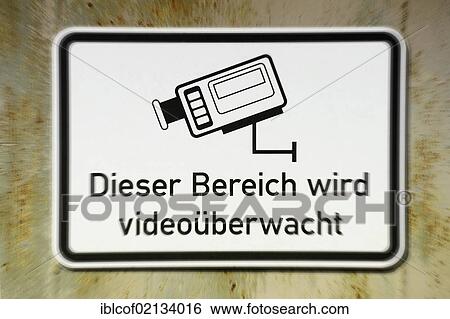 Stock Photograph - Sign "Dieser Bereich wird videoueberwacht", German for "this area is under video surveillance", video surveillance. Fotosearch