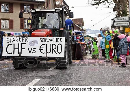 Sign lettering "Starker CHF vs. schwacher Euro", German for "Strong Swiss franc vs. weak euro", commemorative float on the economic crisis, banking and debt crisis, 35th Motteri-Umzug parade in Malters, Lucerne, Switzerland, Europe View Large Photo Image Stock Image - Sign lettering "Starker CHF vs. schwacher Euro", German for "Strong Swiss franc vs. weak euro", commemorative float on the economic crisis, banking and debt crisis, 35th Motteri-Umzug parade in Malters, Lucerne, Switzerland, Europe. Fotosearch