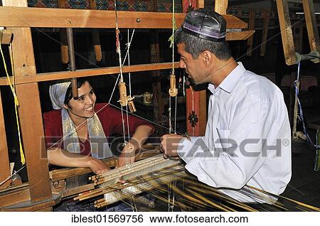 Silk production, Usbek man and woman working on a wooden loom, Silk Road, Fergana Valley, Uzbekistan, Central Asia, Asia View Large Photo Image Stock Photograph - Silk production, Usbek man and woman working on a wooden loom, Silk Road, Fergana Valley, Uzbekistan, Central Asia, Asia. Fotosearch