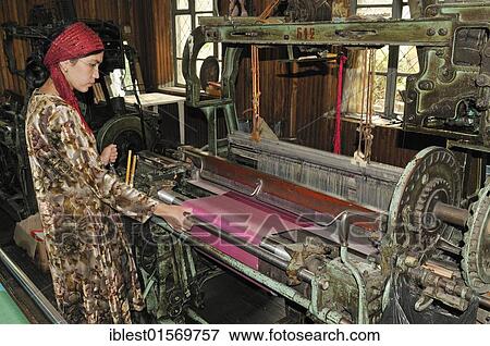 Silk production, Usbek woman working on a mechanical loom, Silk Road, Fergana Valley, Uzbekistan, Central Asia, Asia View Large Photo Image Stock Photo - Silk production, Usbek woman working on a mechanical loom, Silk Road, Fergana Valley, Uzbekistan, Central Asia, Asia. Fotosearch