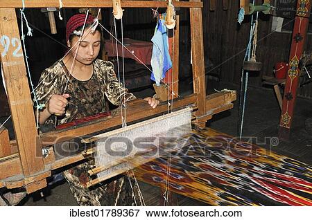 Silk production, Usbek woman working on a wooden loom, Silk Road, Fergana Valley, Uzbekistan, Central Asia, Asia View Large Photo Image Stock Photo - Silk production, Usbek woman working on a wooden loom, Silk Road, Fergana Valley, Uzbekistan, Central Asia, Asia. Fotosearch