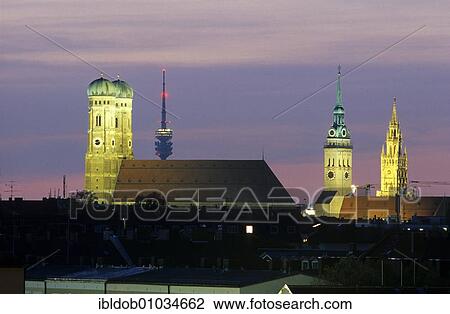Stock Image - Skyline of Munich, Frauenkirche Church, Olympia Tower, Alter Peter Church and the new town hall, Munich, Bavaria, Germany, Europe. Fotosearch