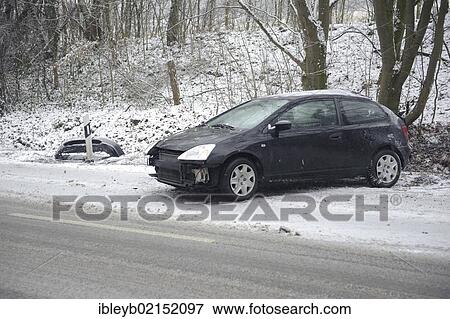 Small car after skidding on a slope in the snow on the Mittleren Filderstrasse road heading towards Plieningen, Stuttgart, Baden-Wuerttemberg, Germany, Europe View Large Photo Image Stock Photo - Small car after skidding on a slope in the snow on the Mittleren Filderstrasse road heading towards Plieningen, Stuttgart, Baden-Wuerttemberg, Germany, Europe. Fotosearch