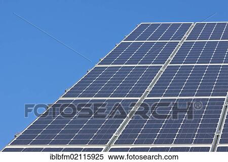 Stock Photography - Solar panels on a house roof, photovoltaic. Fotosearch