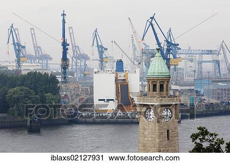 Stock Image - St. Pauli Landungsbruecken, Landing Bridges, with the water level tower in St. Pauli, Hamburg, Germany, Europe. Fotosearch