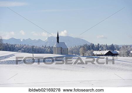 St. Sebastian daughter church, Kleinhartpenning, Mount Benediktenwand at back, Holzkirchen, Upper Bavaria, Bavaria, Germany, Europe View Large Photo Image Stock Photo - St. Sebastian daughter church, Kleinhartpenning, Mount Benediktenwand at back, Holzkirchen, Upper Bavaria, Bavaria, Germany, Europe. Fotosearch