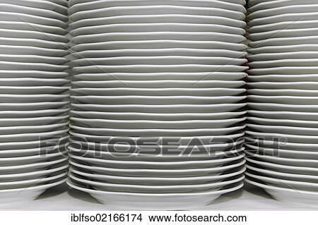 Stacks of white dinner plates on a table, preparations for a corporate event, Thuringia, Germany, Europe View Large Photo Image Picture - Stacks of white dinner plates on a table, preparations for a corporate event, Thuringia, Germany, Europe. Fotosearch