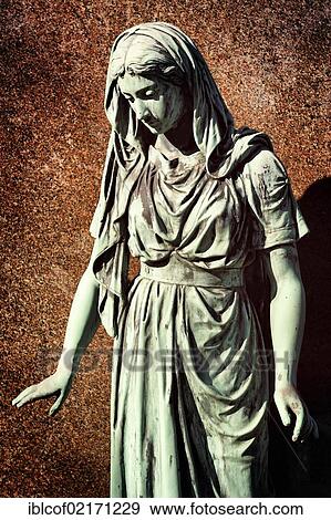Statue of a grieving woman at Ohlsdorf Cemetery in Hamburg, Germany, Europe View Large Photo Image Stock Photo - Statue of a grieving woman at Ohlsdorf Cemetery in Hamburg, Germany, Europe. Fotosearch