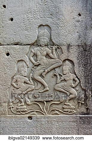 Stone bas-relief of a group of three apsaras dancing on lotuses, Bayon Temple, Angkor Thom, Siem Reap, Cambodia, Southeast Asia, Asia View Large Photo Image Stock Photo - Stone bas-relief of a group of three apsaras dancing on lotuses, Bayon Temple, Angkor Thom, Siem Reap, Cambodia, Southeast Asia, Asia. Fotosearch