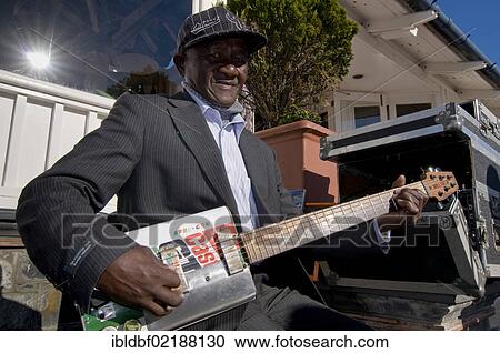 Street musician with a guitar made from oil cans, Cape Town, Western Cape, South Africa, Africa View Large Photo Image Stock Image - Street musician with a guitar made from oil cans, Cape Town, Western Cape, South Africa, Africa. Fotosearch
