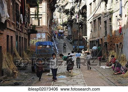 Stock Photograph - Street scene, historic street, Bhaktapur, Kathmandu Valley, Nepal, Asia. Fotosearch