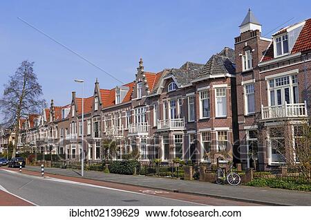 Stock Photo - Street with a row of houses, Alkmaar, North Holland, Holland, Netherlands, Europe. Fotosearch