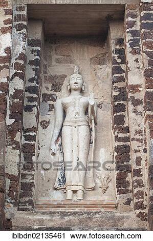 Stock Image - Stucco image of Buddha flanking the base of the Prang, Wat Ratchaburana, Ayutthaya, Thailand, Asia. Fotosearch