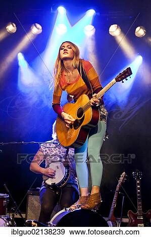 Stock Photo - Sunniva Bondesson, one of the sisters from the Swedish siblings band Baskery, performing live in the Schueuer concert hall, Lucerne, Switzerland, Europe. Fotosearch