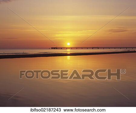 Sunrise over the Baltic Sea, pier in Prerow, Darss peninsula, Mecklenburg-Western Pomerania, Baltic Sea, Germany, Europe View Large Photo Image Stock Image - Sunrise over the Baltic Sea, pier in Prerow, Darss peninsula, Mecklenburg-Western Pomerania, Baltic Sea, Germany, Europe. Fotosearch