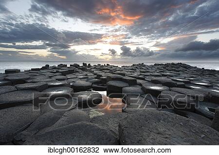 Sunset at the basalt columns of the Giant's Causeway, Londonderry, North Ireland View Large Photo Image Stock Image - Sunset at the basalt columns of the Giant's Causeway, Londonderry, North Ireland. Fotosearch