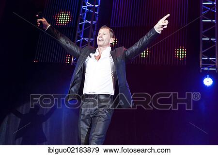 Stock Photo - Swiss pop singer Leonard performing live at the Schlager Nacht 2012, pop music event, in Lucerne, Switzerland, Europe. Fotosearch