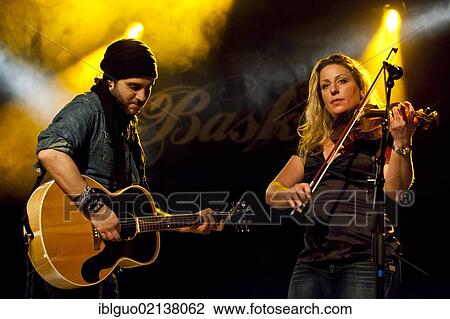 Swiss singer and musician Reto Burrell with Barbara Wildberger performing live in the Schueuer concert hall, Lucerne, Switzerland, Europe View Large Photo Image Stock Image - Swiss singer and musician Reto Burrell with Barbara Wildberger performing live in the Schueuer concert hall, Lucerne, Switzerland, Europe. Fotosearch