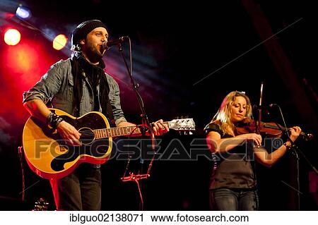 Stock Image - Swiss singer and musician Reto Burrell with Barbara Wildberger performing live in the Schueuer concert hall, Lucerne, Switzerland, Europe. Fotosearch