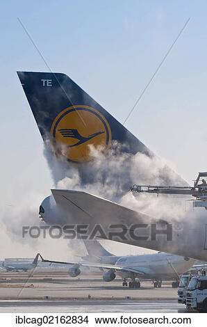 Tail of a Lufthansa Boeing 747-430M being de-iced at Frankfurt Airport, Hesse, Germany, Europe, PublicGround, Europe View Large Photo Image Picture - Tail of a Lufthansa Boeing 747-430M being de-iced at Frankfurt Airport, Hesse, Germany, Europe, PublicGround, Europe. Fotosearch