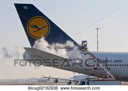Tail of a Lufthansa Boeing 747-430M being de-iced at Frankfurt Airport, Hesse, Germany, Europe, PublicGround, Europe View Large Photo Image Stock Photograph - Tail of a Lufthansa Boeing 747-430M being de-iced at Frankfurt Airport, Hesse, Germany, Europe, PublicGround, Europe. Fotosearch
