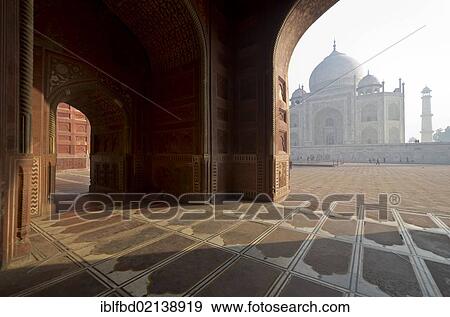Stock Photo - Taj Mahal, UNESCO World Heritage, seen through one of the huge gates of the surrounding buildings, Agra, Uttar Pradesh, India, Asia. Fotosearch