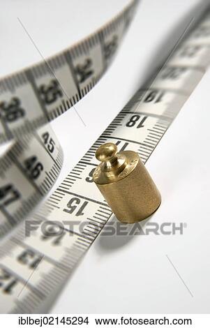 Tape measure, scale weight, symbolic image weight cuts View Large Photo Image Picture - Tape measure, scale weight, symbolic image weight cuts. Fotosearch