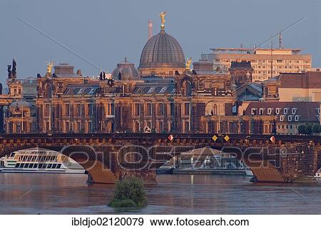 The glass cupola of Dresden Academy of Fine Arts behind Augustusbruecke bridge crossing the river Elbe in evening light, Friedrichstadt, Dresden, Saxony, Germany, Europe View Large Photo Image Stock Photo - The glass cupola of Dresden Academy of Fine Arts behind Augustusbruecke bridge crossing the river Elbe in evening light, Friedrichstadt, Dresden, Saxony, Germany, Europe. Fotosearch