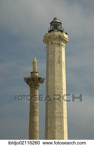 The lighthouse and the statue of the Virgin Mary in Marina Di Leuca, Puglia, Italy, Europe View Large Photo Image Stock Image - The lighthouse and the statue of the Virgin Mary in Marina Di Leuca, Puglia, Italy, Europe. Fotosearch