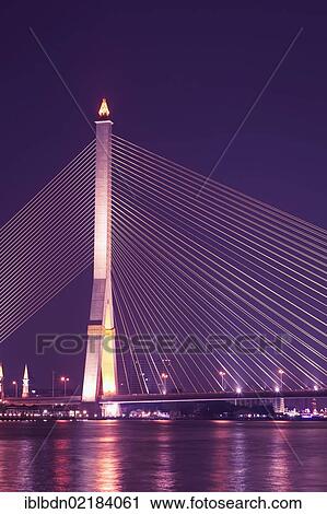 Stock Image - The Rama VIII Bridge in Bangkok at night, Thailand, Asia. Fotosearch
