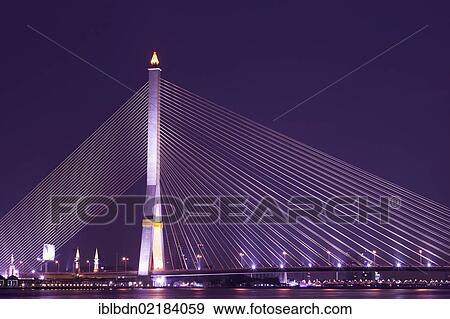 Stock Photo - The Rama VIII Bridge in Bangkok at night, Thailand, Asia. Fotosearch