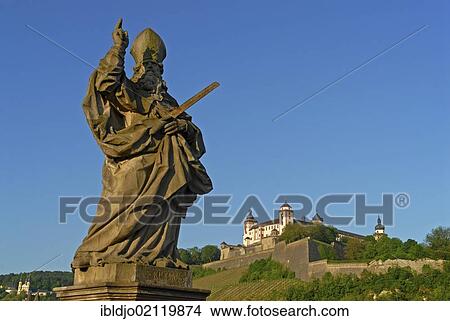 The statue of Saint Kilian on the Alte Mainbruecke, Old Main Bridge with the Festung Marienberg, Marienberg Fortress at back, Wuerzburg, Lower Franconia, Bavaria, Germany, Europe View Large Photo Image Picture - The statue of Saint Kilian on the Alte Mainbruecke, Old Main Bridge with the Festung Marienberg, Marienberg Fortress at back, Wuerzburg, Lower Franconia, Bavaria, Germany, Europe. Fotosearch
