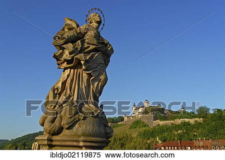 The statue of Virgin Mary as Patrona Franconiae on the Alte Mainbruecke, Old Main Bridge with the Festung Marienberg, Marienberg Fortress at back, Wuerzburg, Lower Franconia, Bavaria, Germany, Europe View Large Photo Image Stock Photography - The statue of Virgin Mary as Patrona Franconiae on the Alte Mainbruecke, Old Main Bridge with the Festung Marienberg, Marienberg Fortress at back, Wuerzburg, Lower Franconia, Bavaria, Germany, Europe. Fotosearch