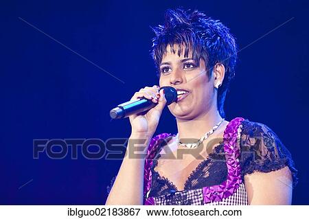 The Swiss pop and folk music singer Sarah-Jane performing live at the Schlager Nacht 2012, pop music event, in Lucerne, Switzerland, Europe View Large Photo Image Stock Photo - The Swiss pop and folk music singer Sarah-Jane performing live at the Schlager Nacht 2012, pop music event, in Lucerne, Switzerland, Europe. Fotosearch
