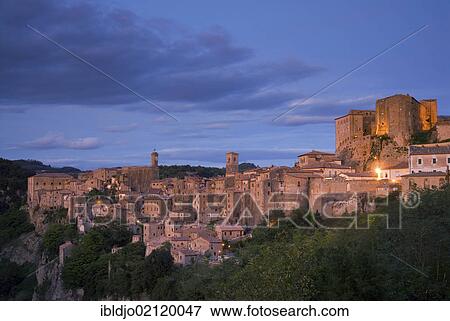 The tufa town of Sorano at the blue hour, Tuscany, Italy, Europe View Large Photo Image Stock Photo - The tufa town of Sorano at the blue hour, Tuscany, Italy, Europe. Fotosearch
