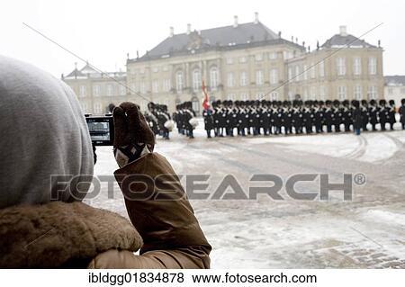 Tourist filming the Changing of the Guard, Amalienborg Palace, Copenhagen, Denmark, Europe View Large Photo Image Stock Photo - Tourist filming the Changing of the Guard, Amalienborg Palace, Copenhagen, Denmark, Europe. Fotosearch