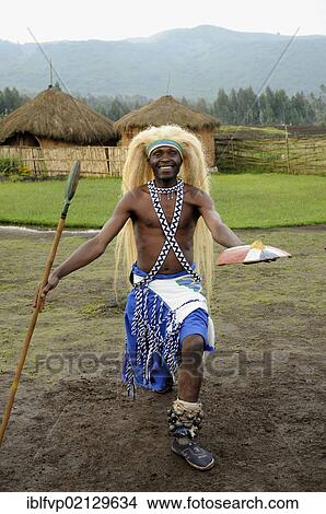 Traditional dancer during a folklore event in a village of former hunters near the village of Kinigi on the edge of the Volcanoes National Park, Parc National des Volcans, Rwanda, Africa View Large Photo Image Picture - Traditional dancer during a folklore event in a village of former hunters near the village of Kinigi on the edge of the Volcanoes National Park, Parc National des Volcans, Rwanda, Africa. Fotosearch