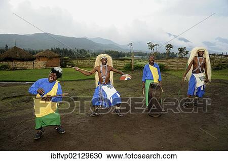 Stock Image - Traditional dancers during a folklore event in a village of former hunters near the village of Kinigi on the edge of the Volcanoes National Park, Parc National des Volcans, Rwanda, Africa. Fotosearch